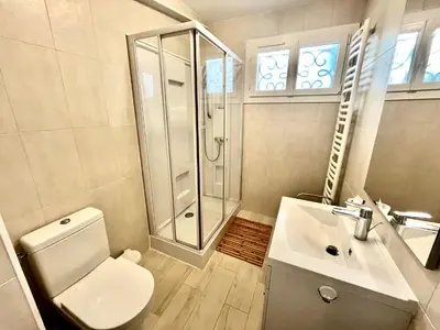 a bathroom with a toilet and a shower and a sink at 45 Clemenceau by Welcome to Cannes in Cannes