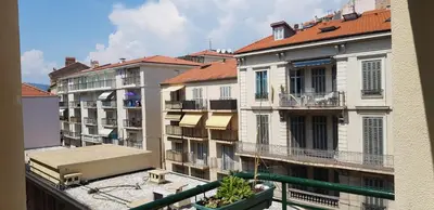 a view of a building from a balcony at 45 Clemenceau by Welcome to Cannes in Cannes