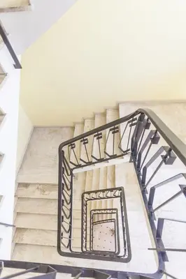 a spiral staircase in a building with a stair case at Lovely One bedroom Martinez Cannes in Cannes