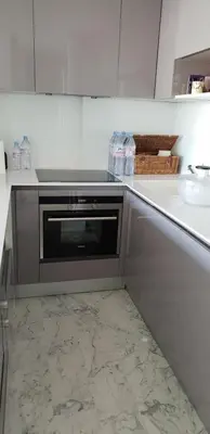 a kitchen with a sink and a microwave at Parc Impérial in Cannes