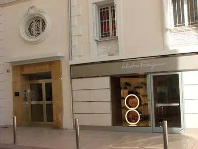 a store front of a building with a pizza at ACCI Cannes Croisette in Cannes