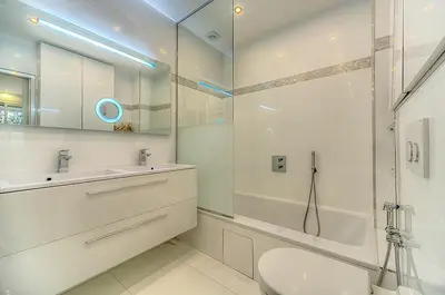 a bathroom with a toilet and a sink and a shower at Appartement l'Age d'Or in Cannes