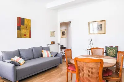 a living room with a couch and a table at ACCI Cannes Riviera in Cannes