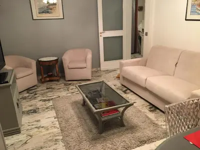 a living room with a couch and a coffee table at Lou Suquetan in Cannes