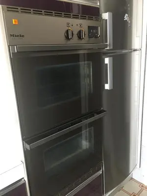 a stainless steel oven is in a kitchen at Lou Suquetan in Cannes