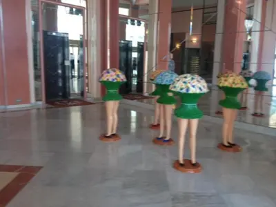 a group of plastic mannequins holding umbrellas in a building at Studio Cannes Croisette in Cannes