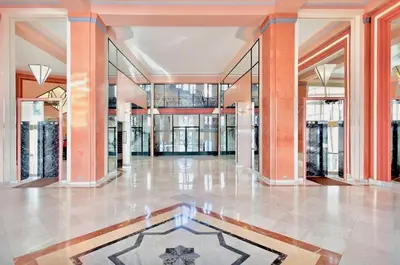 a lobby of a building with a tile floor at Studio Cannes Croisette in Cannes