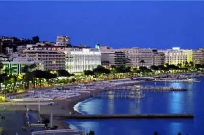 a view of a city with a beach and buildings at Studio Cannes Croisette in Cannes
