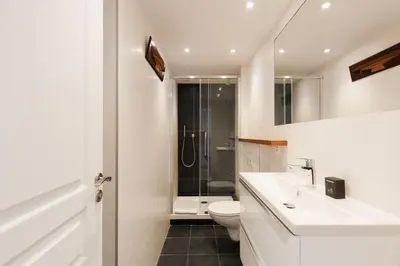 a bathroom with a toilet and a sink and a shower at Mer du Sud 4 YourHostHelper in Cannes