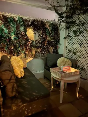 a living room with a couch and a table at Winter Palace Cannes in Cannes
