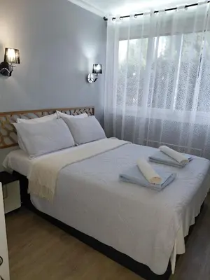 a bedroom with a large bed with towels on it at Palm beach Cannes Azur in Cannes