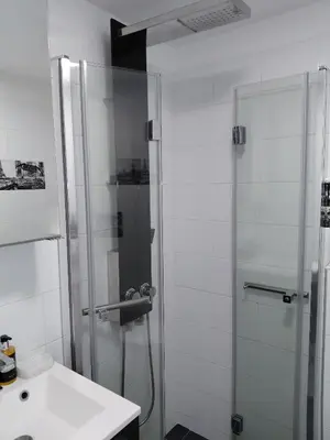 a bathroom with a shower and a sink at Palm beach Cannes Azur in Cannes