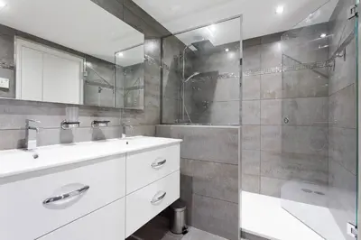 a bathroom with a white sink and a shower at Carlton area: New 2 beds / 2 baths in Cannes