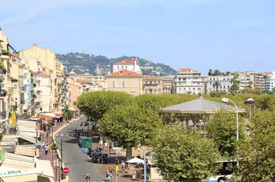 a city street with people walking down a street at Pure & chic 2beds/2baths in centre! in Cannes