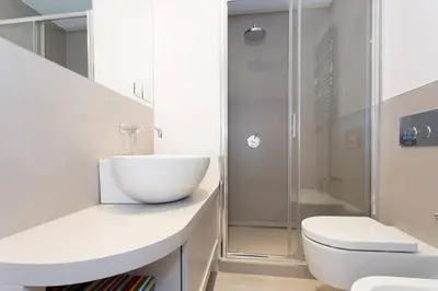 a bathroom with a sink and a toilet and a shower at Pure & chic 2beds/2baths in centre! in Cannes