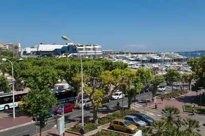 a city with cars parked in a parking lot at Pure & chic 2beds/2baths in centre! in Cannes