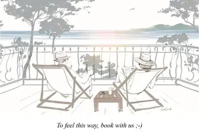 two people sitting in chairs on a balcony with the ocean at Palais Miramar: 1 bed side sea view in Cannes