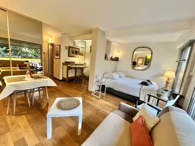 a living room with a couch and a bed at Rouaze by Welcome to Cannes in Cannes