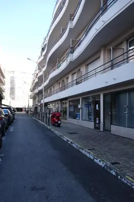 a red scooter parked in front of a building at Rouaze by Welcome to Cannes in Cannes