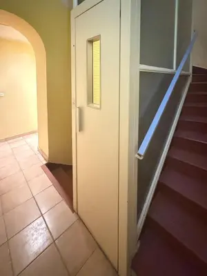 a hallway with a door and a stair case at 1-bedroom appartement in the center of Cannes in Cannes