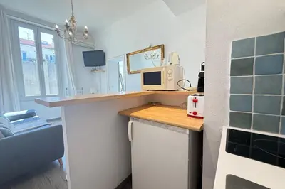a kitchen with a counter with a computer on it at 1-bedroom appartement in the center of Cannes in Cannes