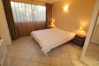 a bedroom with a white bed and a window at 4 bedroom 3 bathrooms sea view Forville Apartment5 mins from the Palais Parking in Cannes