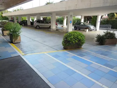 a parking lot with blue tiles on the ground at 4 bedroom 3 bathrooms sea view Forville Apartment5 mins from the Palais Parking in Cannes