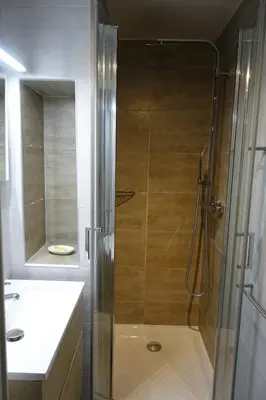 a shower with a glass door in a bathroom at Eden Beach in Cannes