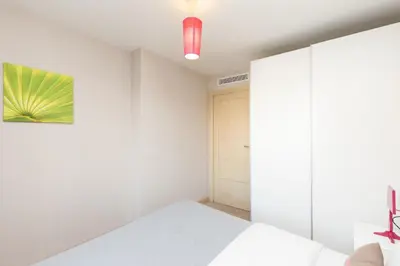 a bedroom with a bed and a closet at 3 bedrooms: 200m from Croisette in Cannes