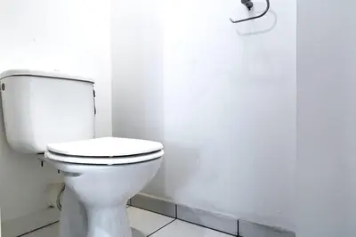 a bathroom with a white toilet in a room at IMMOGROOM - 3min from beach - AC - 10min from Palais - Wifi in Cannes