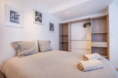a bedroom with a bed with two towels on it at 3 pièces Luxe Croisette in Cannes