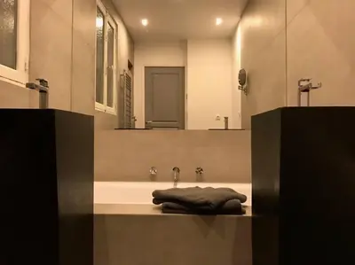 a bathroom with a bath tub with a towel on it at 3 pièces Luxe Croisette in Cannes