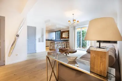 a living room with a couch and a table at 3 pièces Luxe Croisette in Cannes