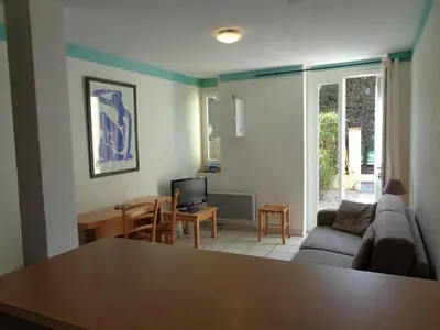 a living room with a couch and a table at Croisette-Oasis in Cannes