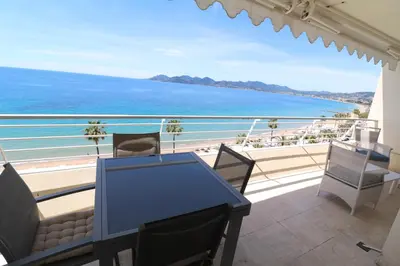 a balcony with a view of the ocean at Amazing sea view 2 bedroom beach front 303 in Cannes