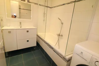 a bathroom with a shower and a sink and a toilet at Amazing sea view 2 bedroom beach front 303 in Cannes