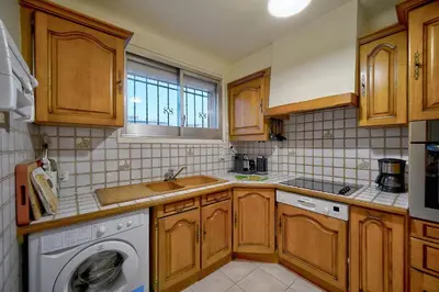a kitchen with a sink and a washing machine at Superbe Duplex TERRASSE vue MER, FELIX FAURE- FORVILLE A1B059 in Cannes
