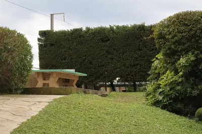 a bench in a park with trees and grass at Appartement Palm d'Azur in Cannes