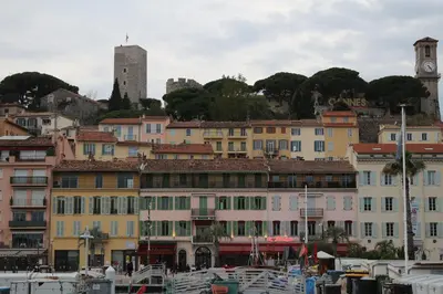 a group of buildings and boats in a harbor at Appartement Palm d'Azur in Cannes