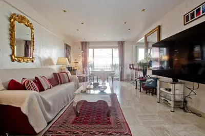 a living room with a couch and a table at Isadora in Cannes