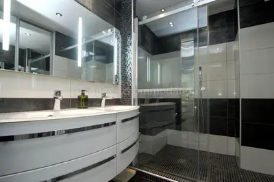 a bathroom with two sinks and a shower at Isadora in Cannes