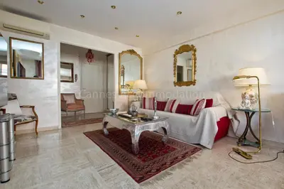 a living room with a couch and a table at Isadora in Cannes