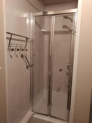 a shower with a glass door in a bathroom at Karolina Properties - Ascot Appartement in Cannes