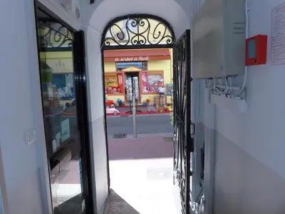 an open door to a store with a window at 1 Bedroom Notre Dame 2 mins from the Croisette and the Palais 225 in Cannes
