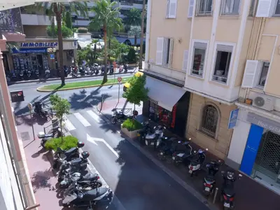 an overhead view of a street with motorcycles parked outside a building at 1 Bedroom Notre Dame 2 mins from the Croisette and the Palais 225 in Cannes