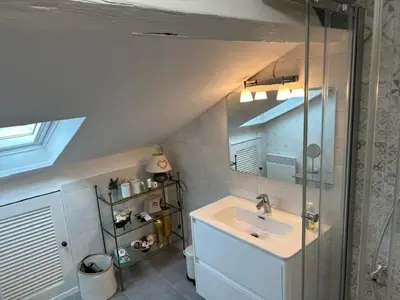 a bathroom with a sink and a mirror at Chez Nella in Cannes