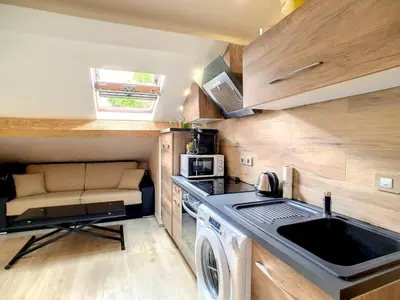 a kitchen with a washing machine and a sink at Love Room Jacuzzi Croisette in Cannes