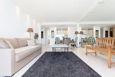 a living room with a couch and a table at SEA VIEW 3 beds next to Palais in Cannes