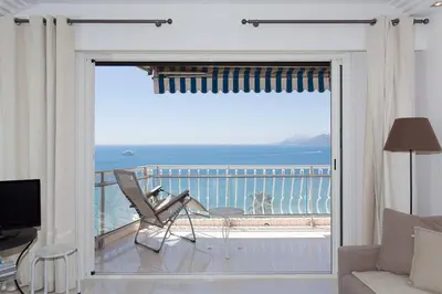 a living room with a view of the ocean at SEA VIEW 3 beds next to Palais in Cannes