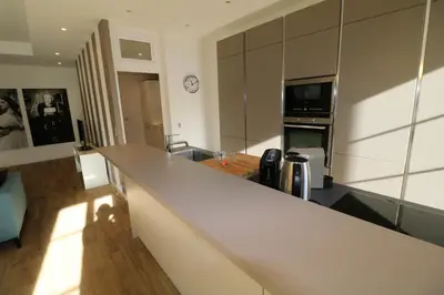 a kitchen with a counter top in a room at Luxury, central 3 bedroom, 3 bathrooms 5 mins from the Palais 410 in Cannes